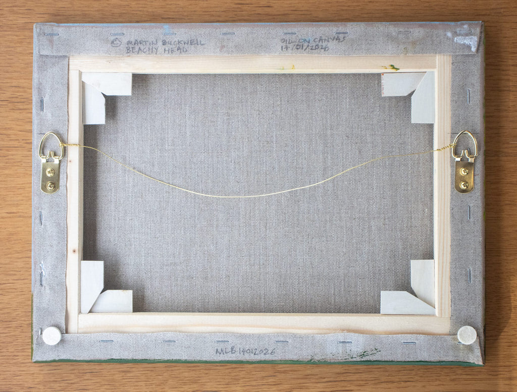 A picture of the back of Beachy Head painting canvas with written title by Martin Buckwell