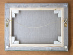 A picture of the back of Beachy Head painting canvas with written title by Martin Buckwell