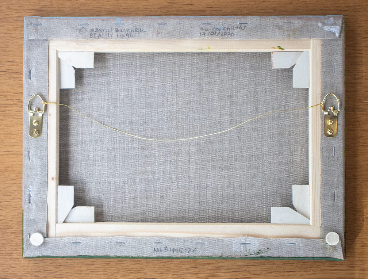 A picture of the back of Beachy Head painting canvas with written title by Martin Buckwell