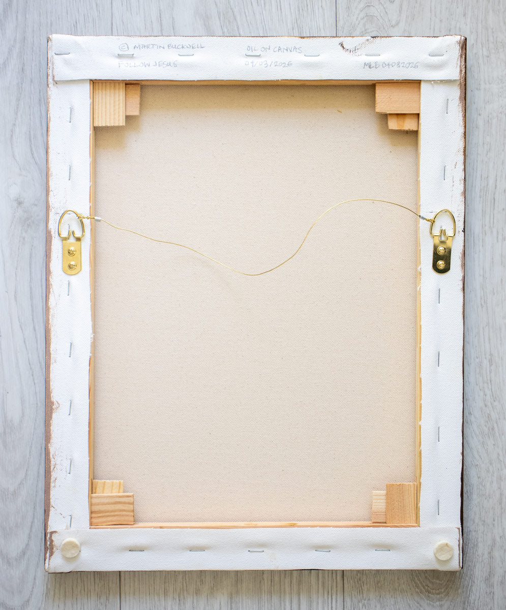 A picture of the back of Follow Jesus  painting canvas with hangers and written title by Martin Buckwell