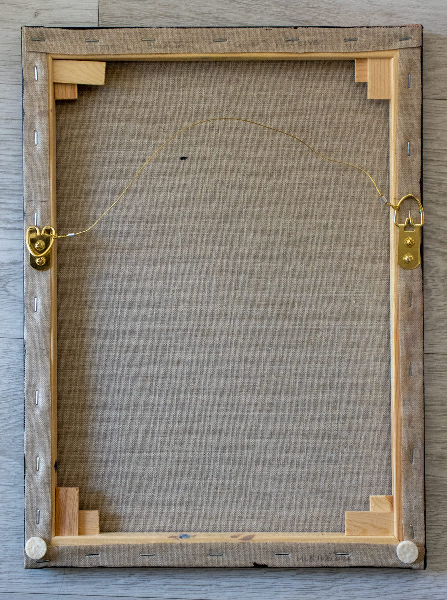 A picture of the back of Give to Receive painting canvas with hangers and written title by Martin Buckwell
