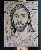 A photograph of an original oil painting of a Historically accurate Jesus portrait in its early stages by Martin Buckwell