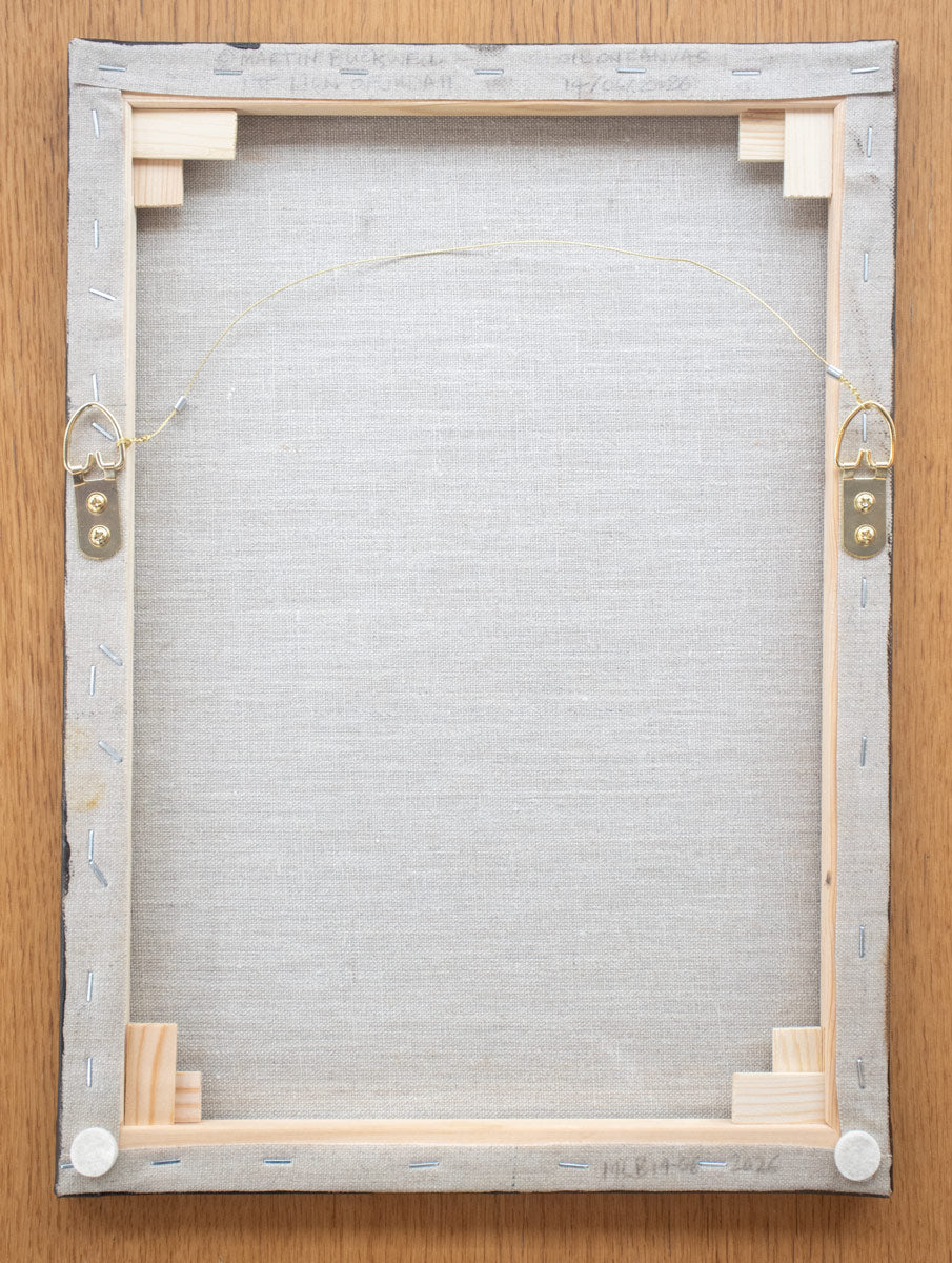 A picture of the back of The Lion of Judah painting canvas with hangers and written title by Martin Buckwell