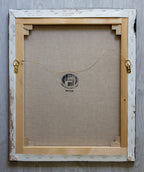 A picture of the back of The Lost Sheep painting canvas with hangers and written title by Martin Buckwell