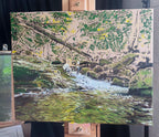 A picture of my painting process for an original oil painting of my daughter filling a bottle of water from a waterfall in the mountains, in Bulgaria, by Martin Buckwell