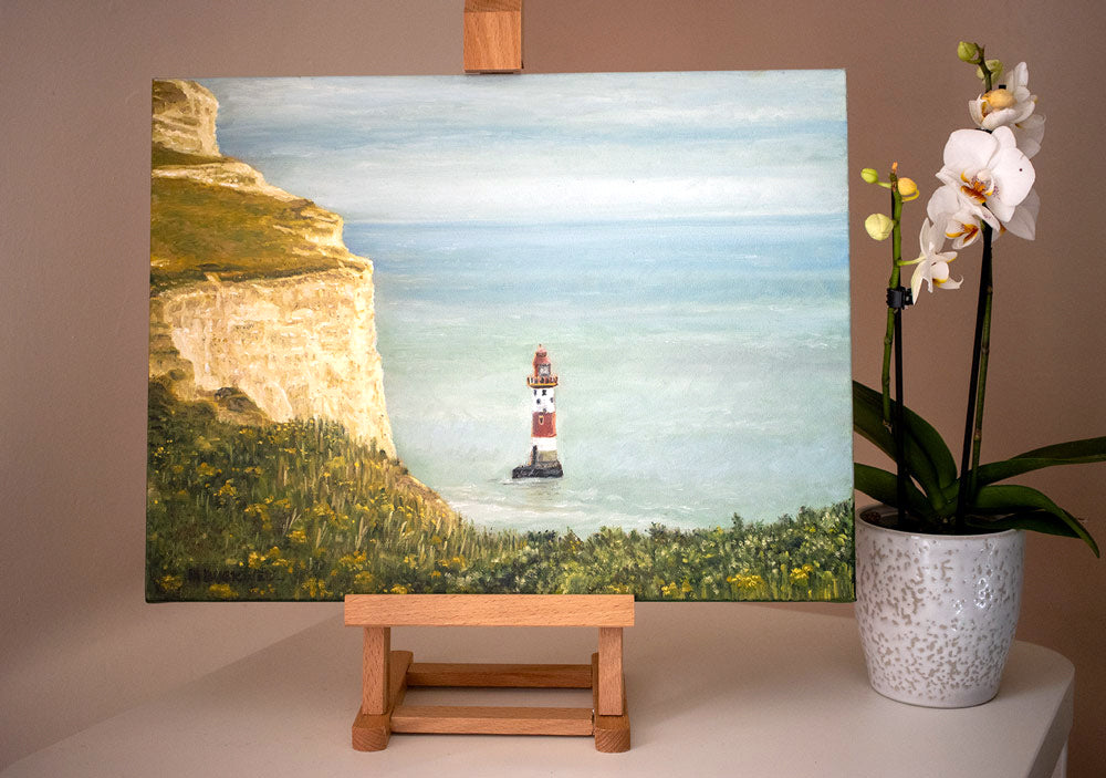A photograph of an original oil painting of the view at Beachy Head of the white chalk cliffs in Spring time, by Martin Buckwell